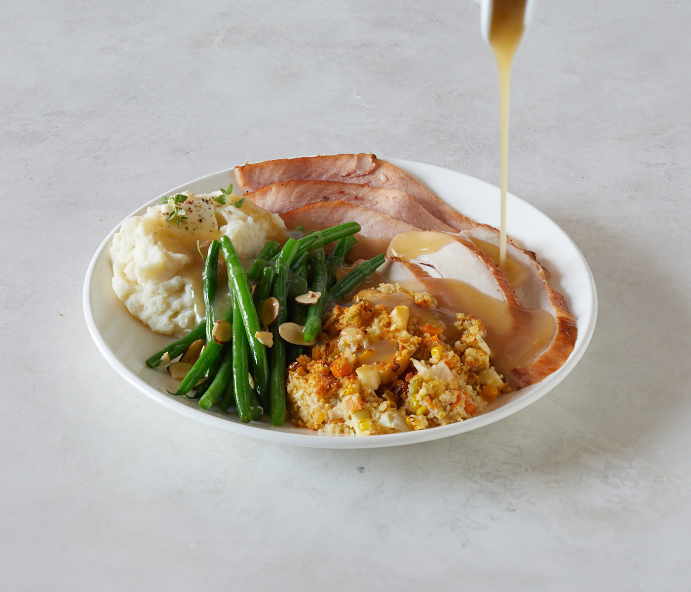 gravy being poured on food