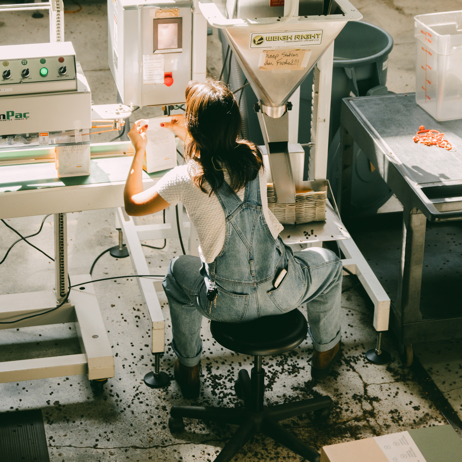 person working on coffee grinds