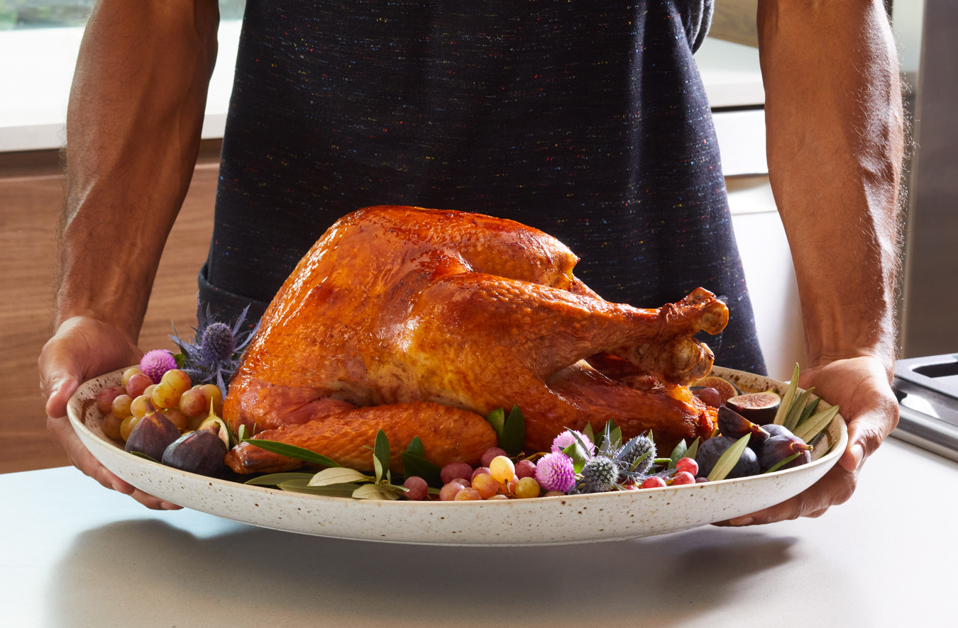 cooked turkey served on platter with sides