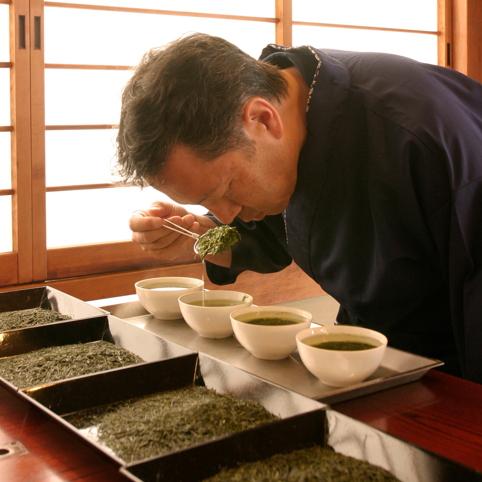 man smelling herbs