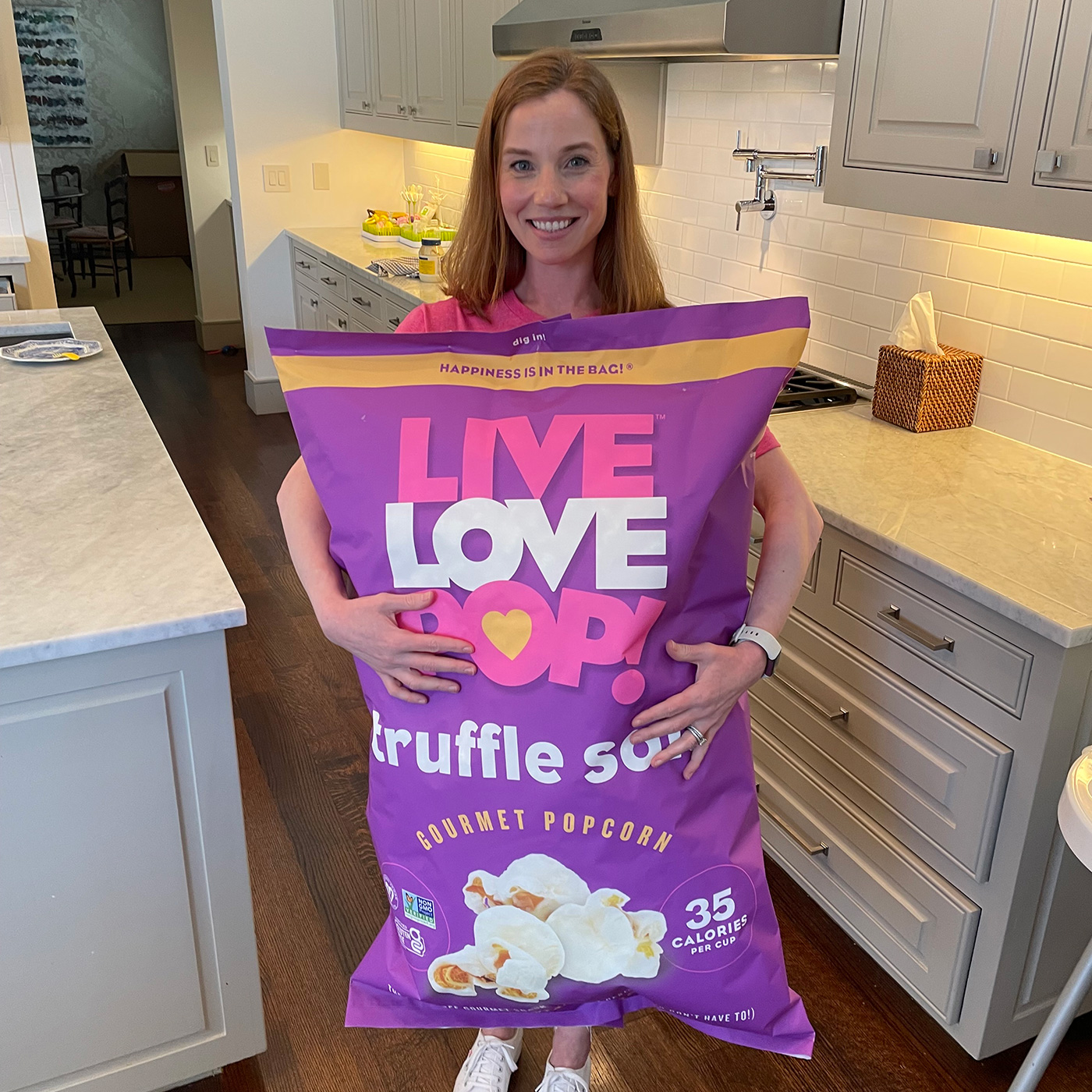 girl with giant bag of popcorn