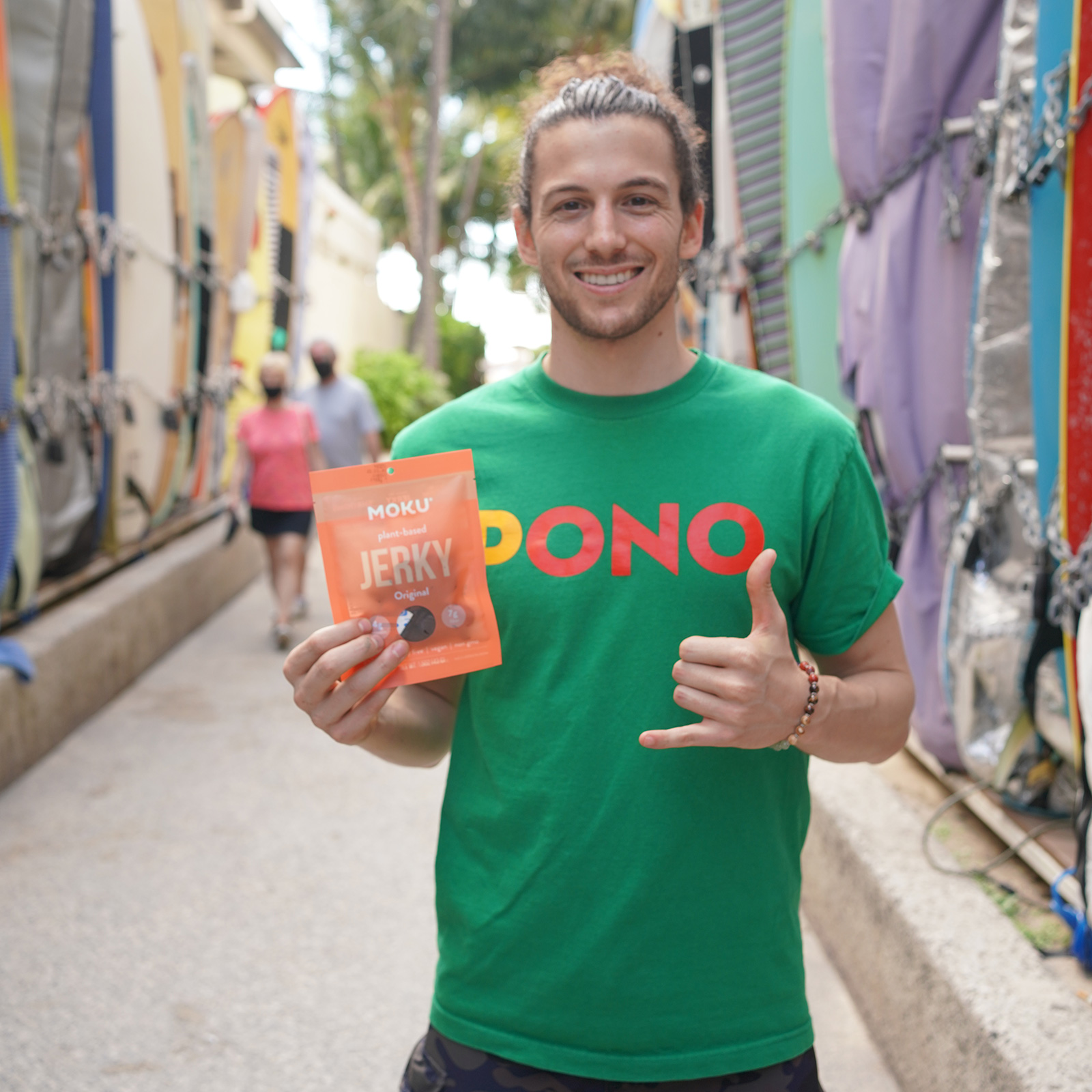 man holding a bag of moku